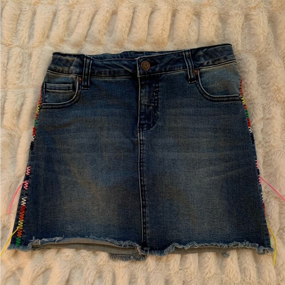 Darling denim skirt with rainbow stitching down the sides!